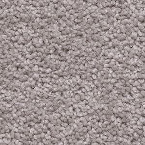 A close up of a pile of gray carpet.