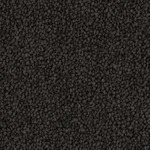 A close up of a black carpet texture.