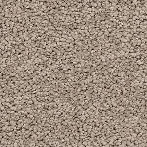 A close up of a carpet with a lot of small stones on it.