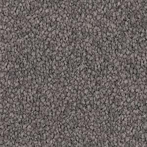 A close up of a gray carpet texture.