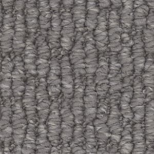 A close up of a gray carpet with a striped pattern.