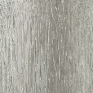 A close up of a gray wood grain texture.