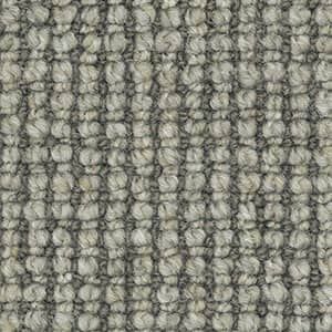 A close up of a gray carpet texture.