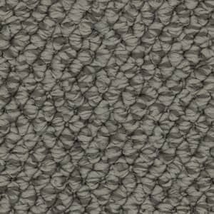 A close up of a gray carpet texture.