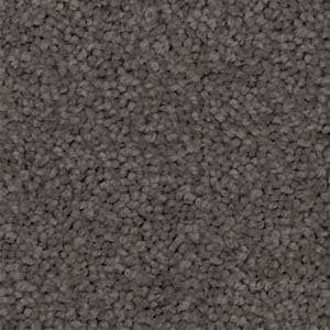 A close up of a gray carpet texture.