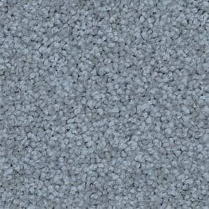 A close up of a light blue carpet texture.