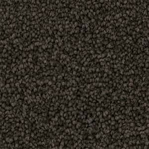 A close up of a brown carpet texture.