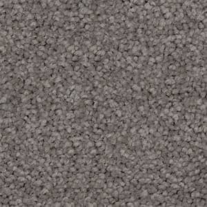 A close up of a gray carpet texture.