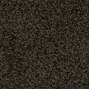 A close up of a black carpet texture.
