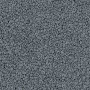 A close up of a gray carpet texture.
