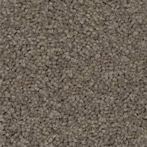 A close up of a carpet with a lot of small stones on it.