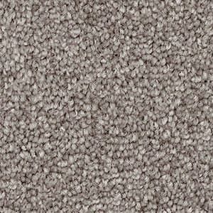 A close up of a carpet with a lot of small stones on it.