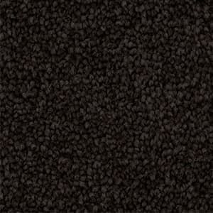 A close up of a black carpet texture.