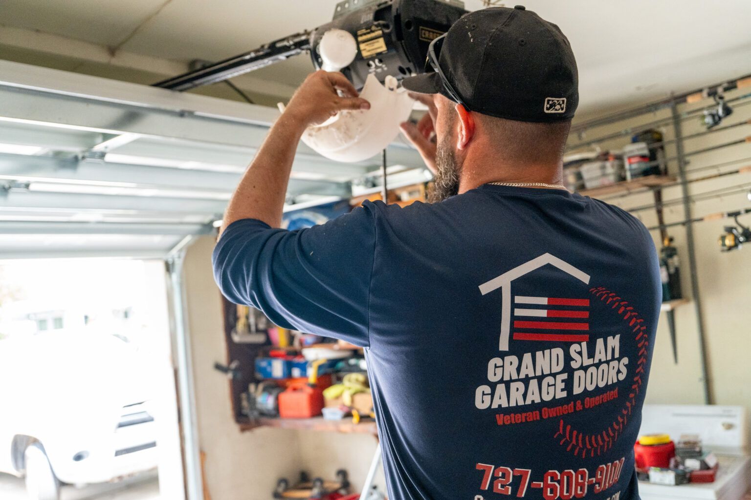 Man fixing garage door Man fixing garage door