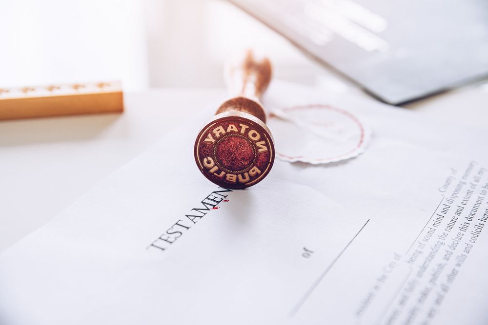 A stamp is sitting on top of a testamentary document