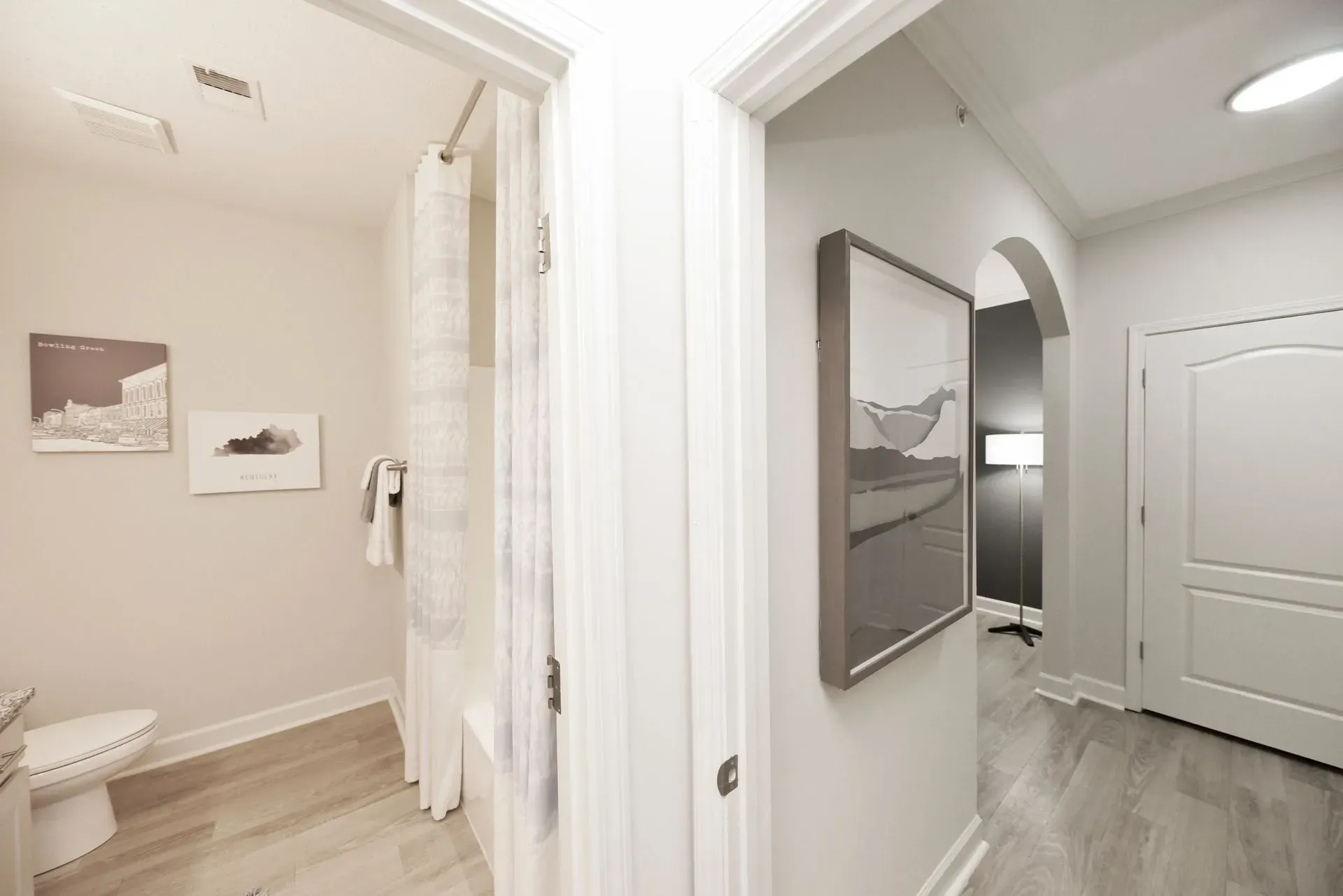 Bathroom with toilet and shower curtain