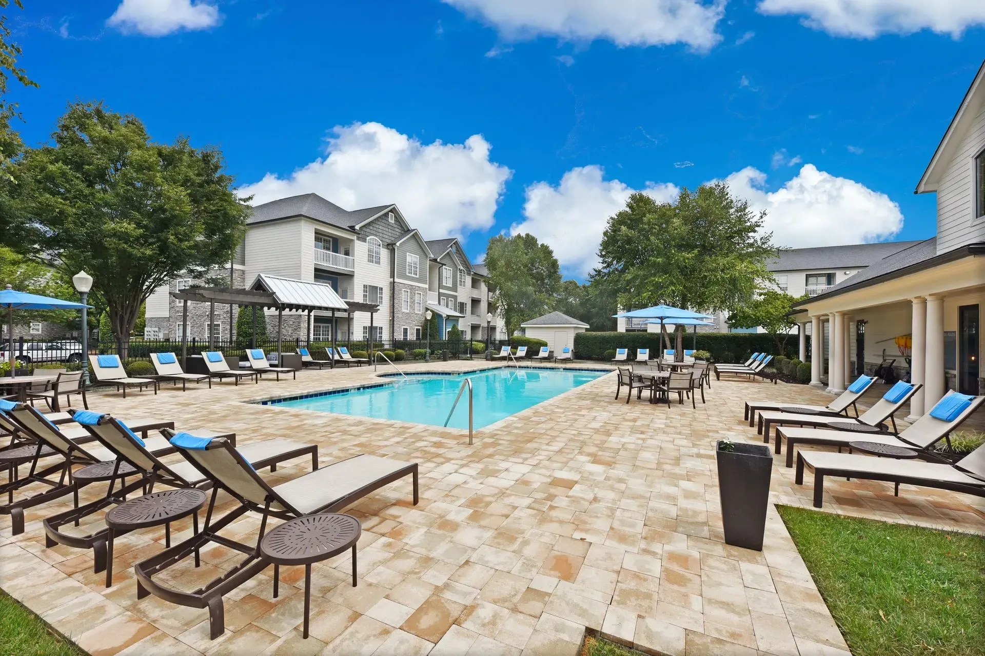 Swimming pool and lounge chairs at apartment complex