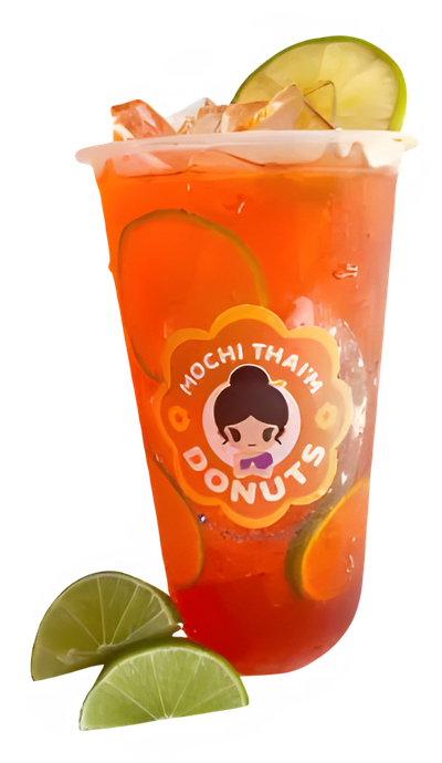 a cup of mochi thai donuts iced tea with lime slices on a white background .