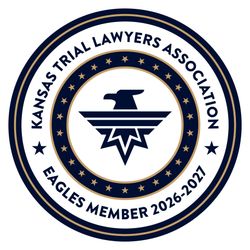 Kansas Trial Lawyers Association Eagles member 2026-2027 circular navy and gold emblem
