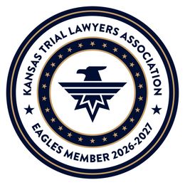 Kansas Trial Lawyers Association Eagles member 2026-2027 circular navy and gold emblem