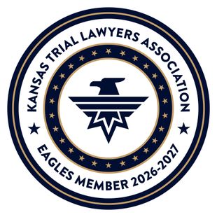 Kansas Trial Lawyers Association Eagles member 2026-2027 circular navy and gold emblem