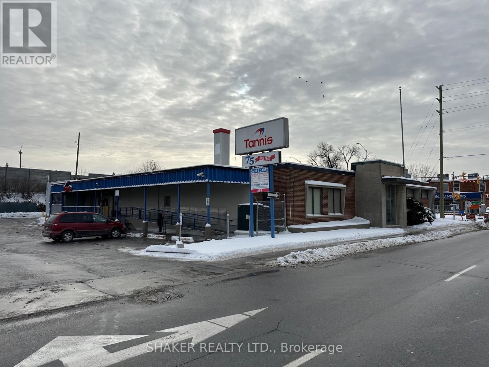 A commercial building with a sign that reads