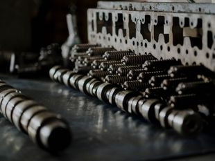 A bunch of metal pieces are stacked on top of each other on a table