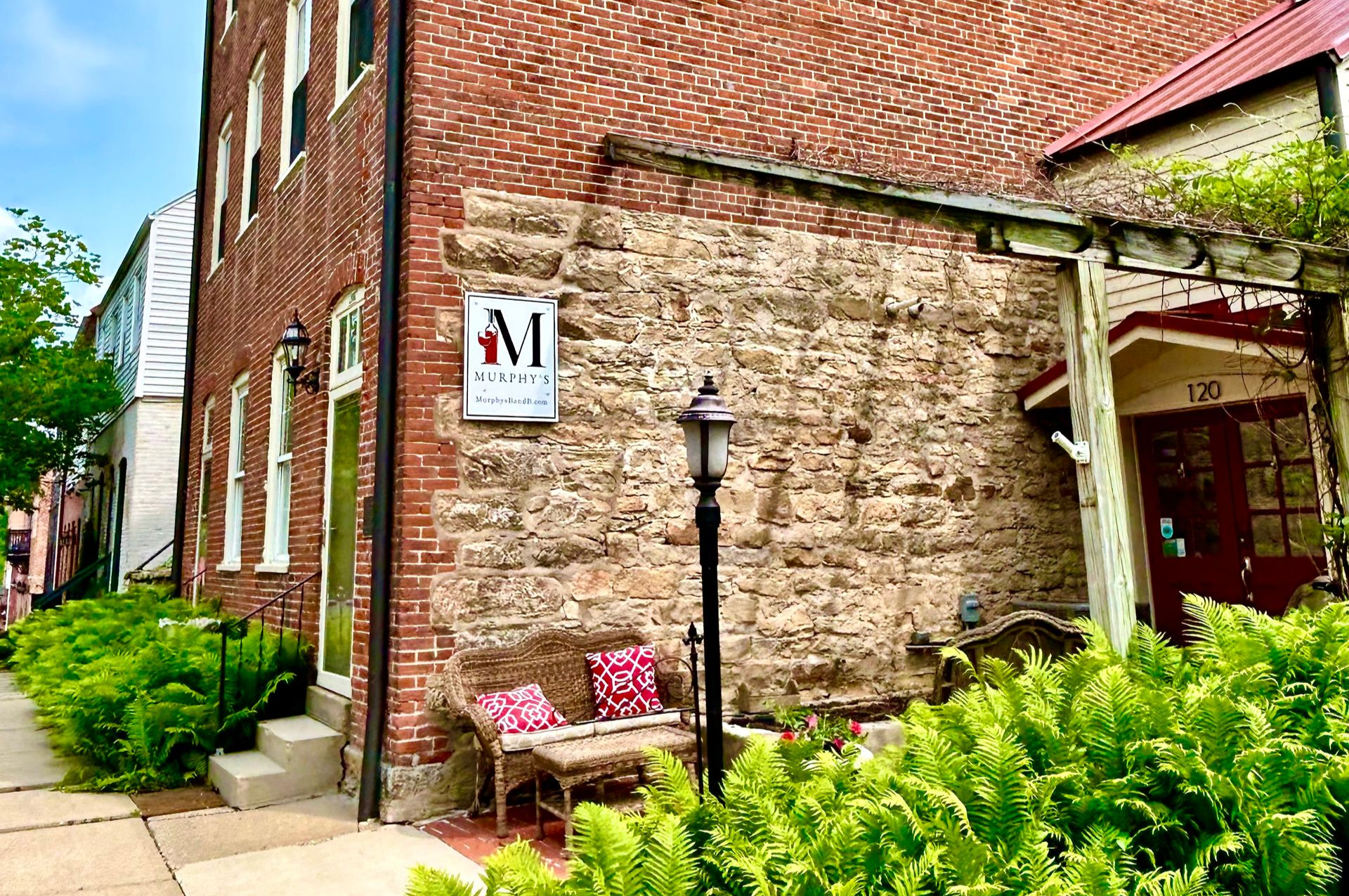Brick building with a stone wall and an