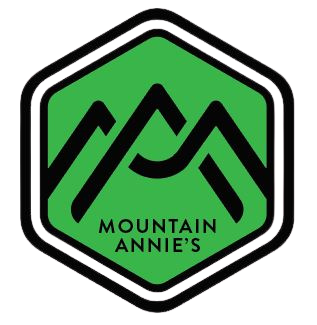A green hexagon logo with a black mountain silhouette and the text