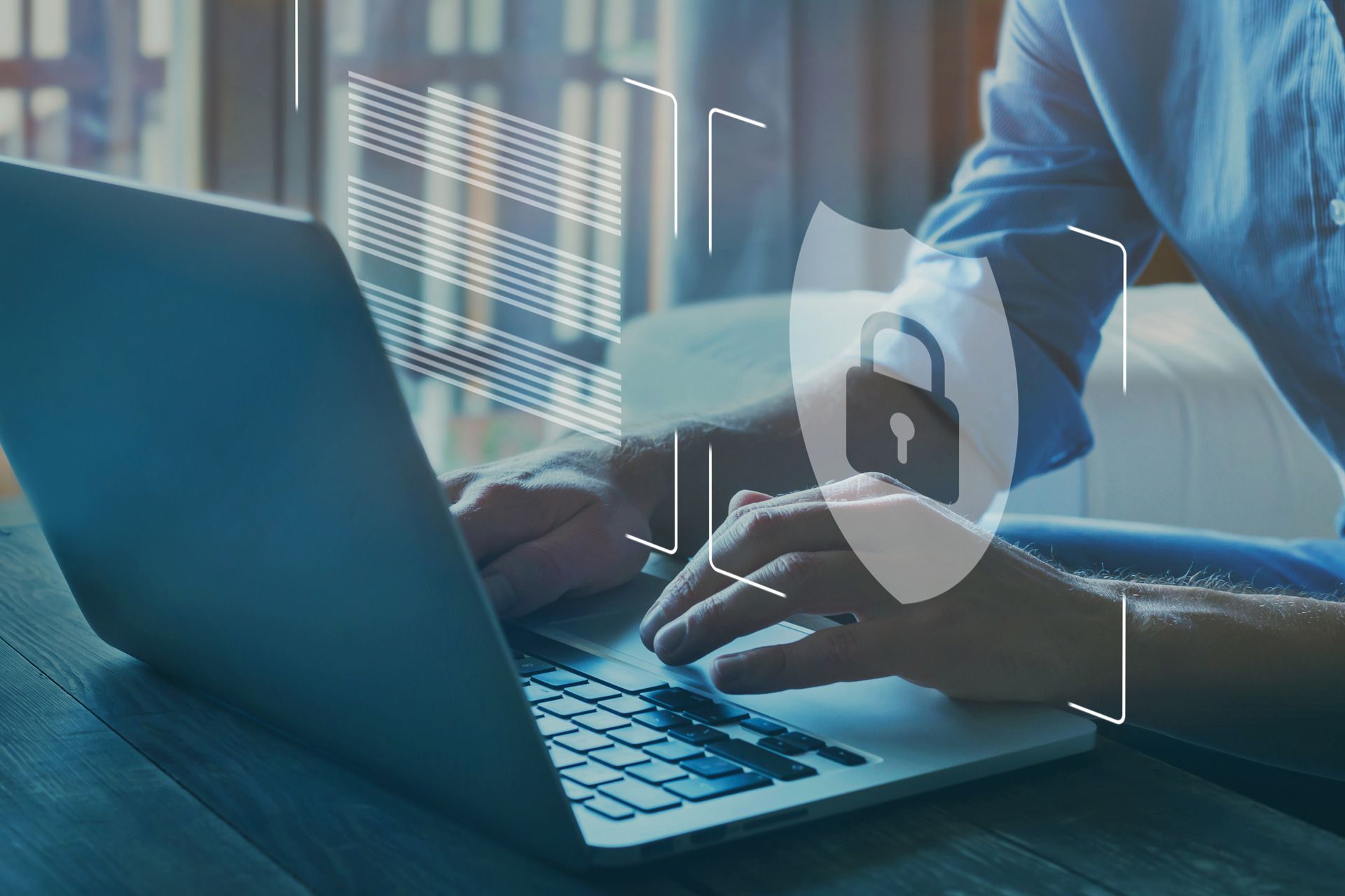 Cybersecurity concept with a person using a laptop and digital lock overlay.