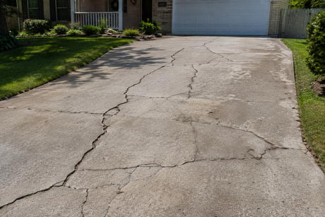 An image of a cracked concrete driveway in New Rochelle, NY