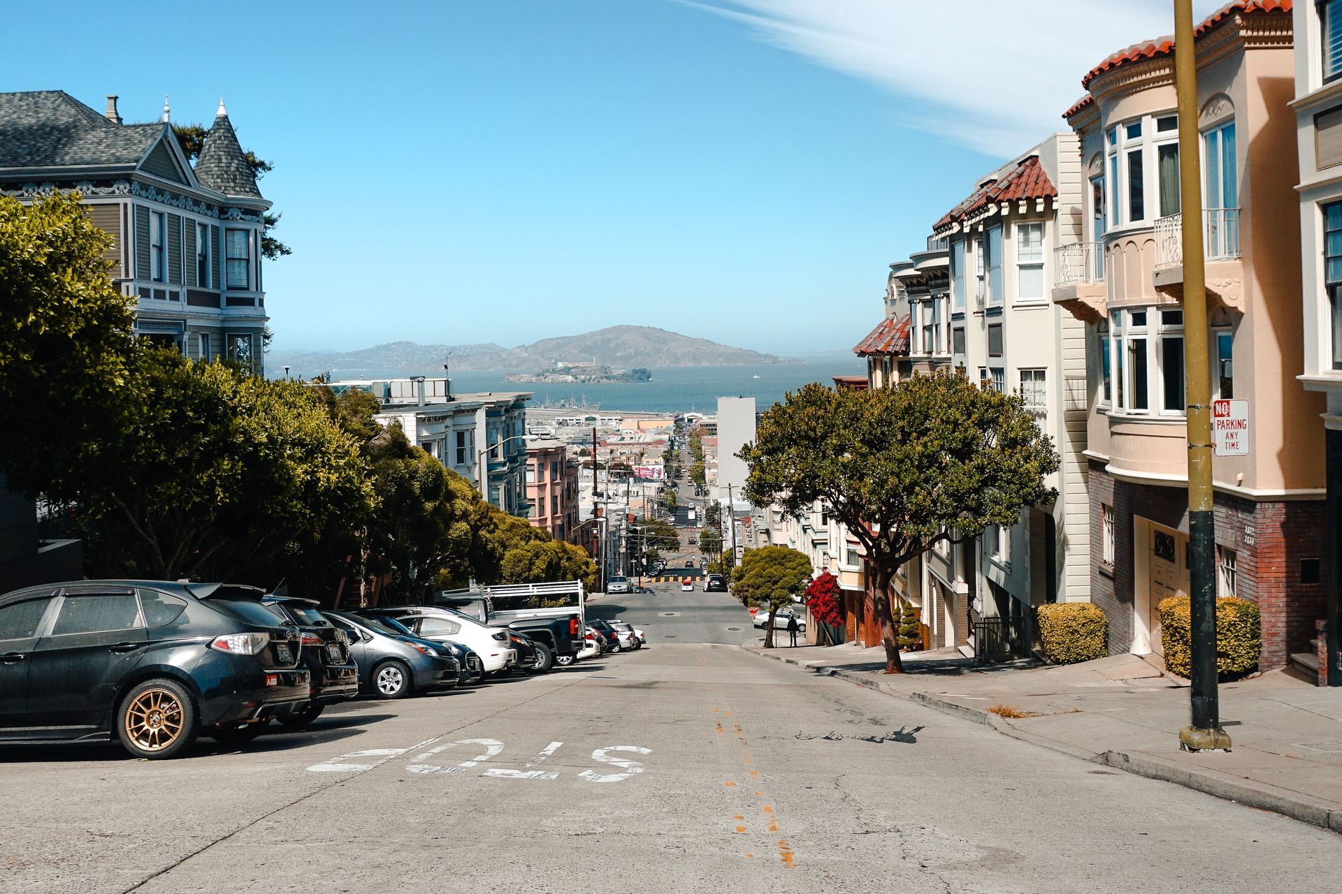 A street with a lot of cars parked on it