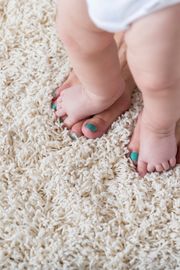 Unrecognizable Baby Walks on Her Moms Feet on the Carpet — Cairns, QLD — Big Red Carpet Shampooing Unrecognizable Baby Walks on Her Moms Feet on the Carpet — Cairns, QLD — Big Red Carpet Shampooing