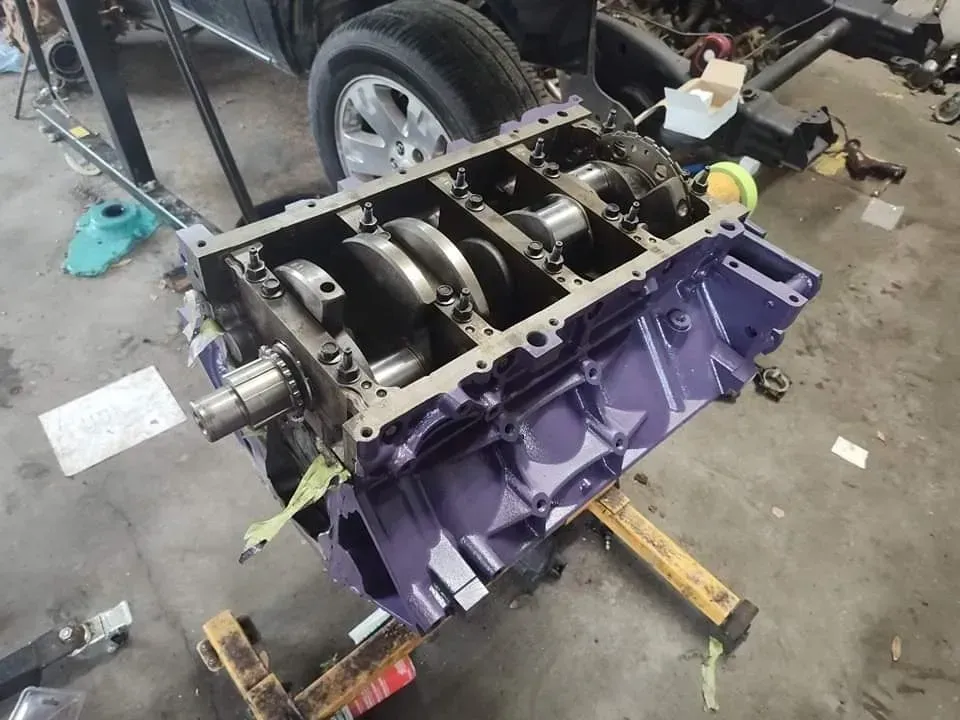 Purple Engine Block on a Pallet in a Garage | McCartha's Auto Service, LLC
