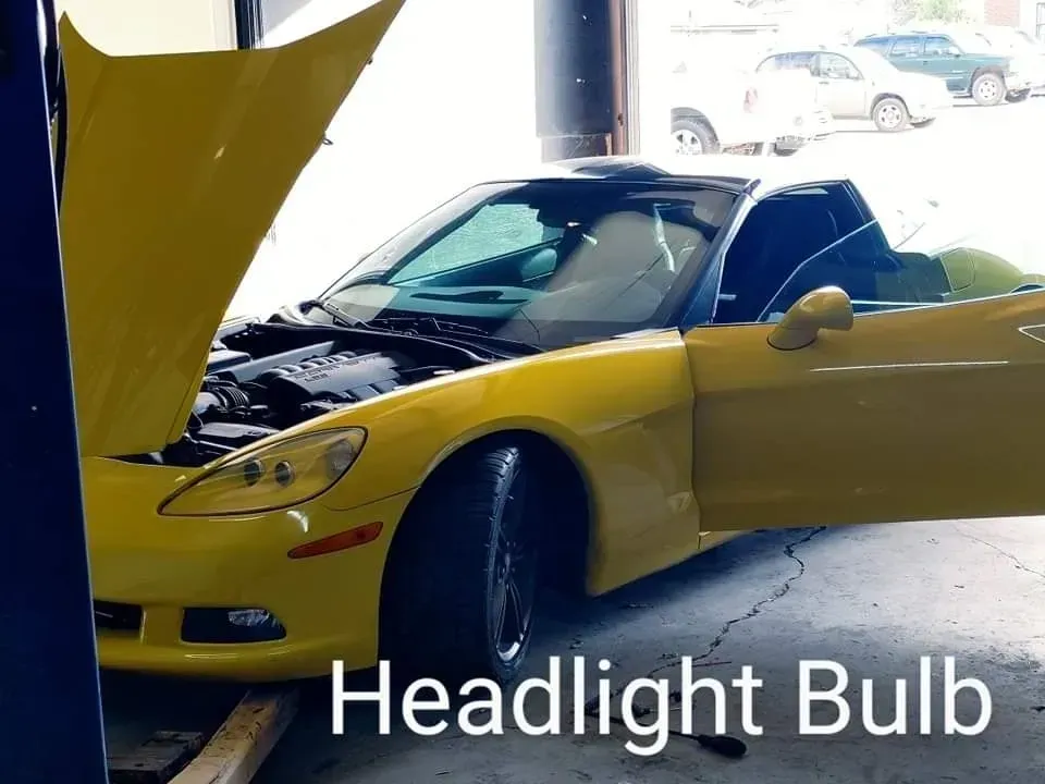 Yellow Sports Car in a Garage, Labeled “Headlight Bulb” | McCartha's Auto Service, LLC