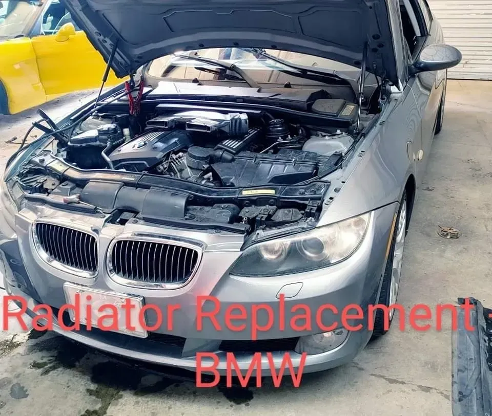 Silver BMW in a Repair Shop, Labeled “Radiator Replacement BMW” | McCartha's Auto Service, LLC