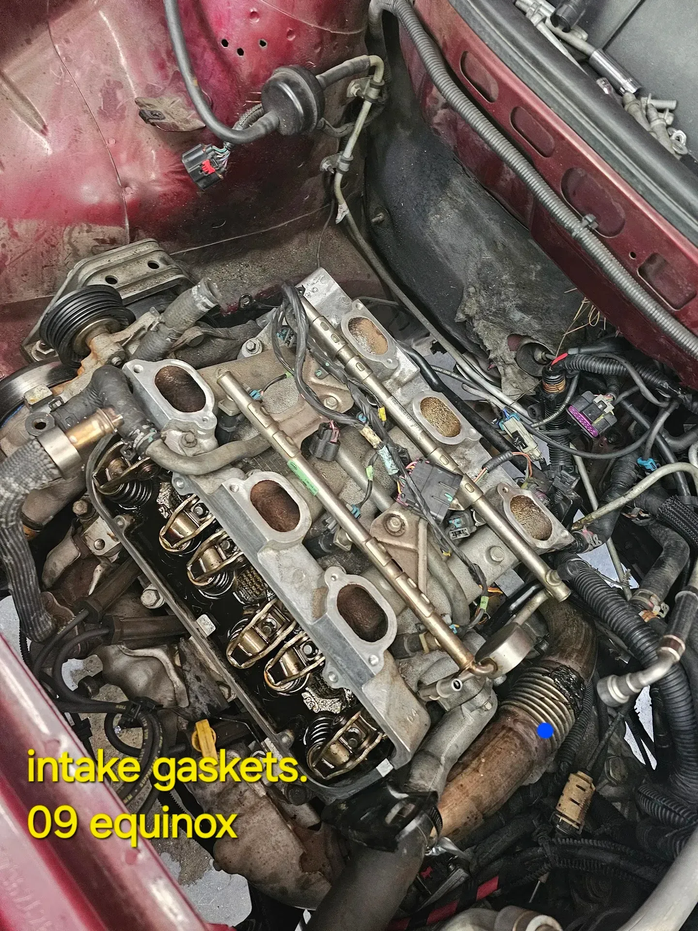 Car Engine with Intake Manifold Removed in a red 2009 Equinox | McCartha's Auto Service, LLC