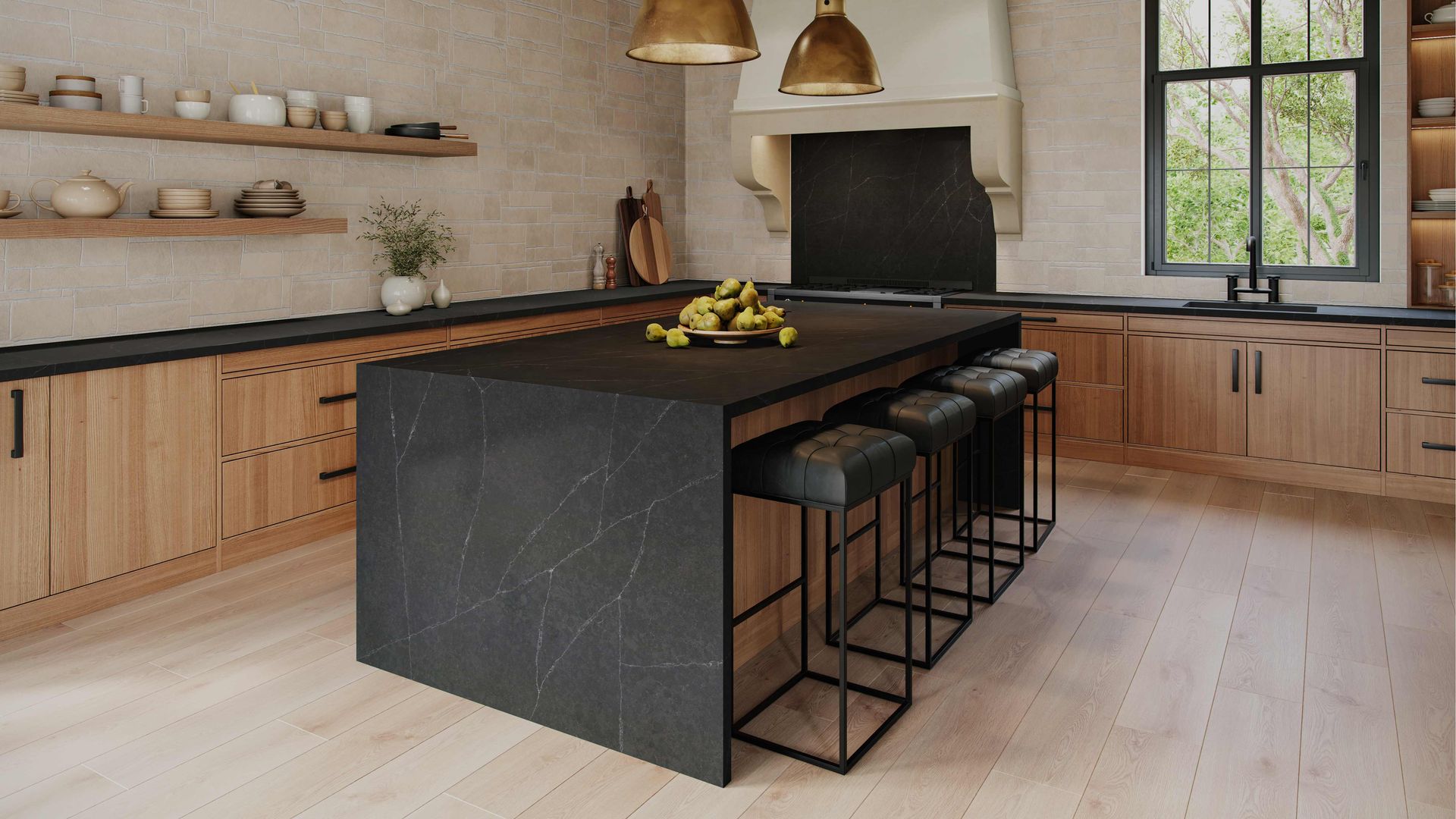 Modern kitchen with black island, wooden cabinets, and brass pendant lights.