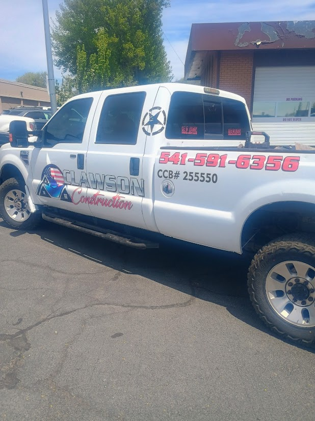 White pickup truck with business logo 