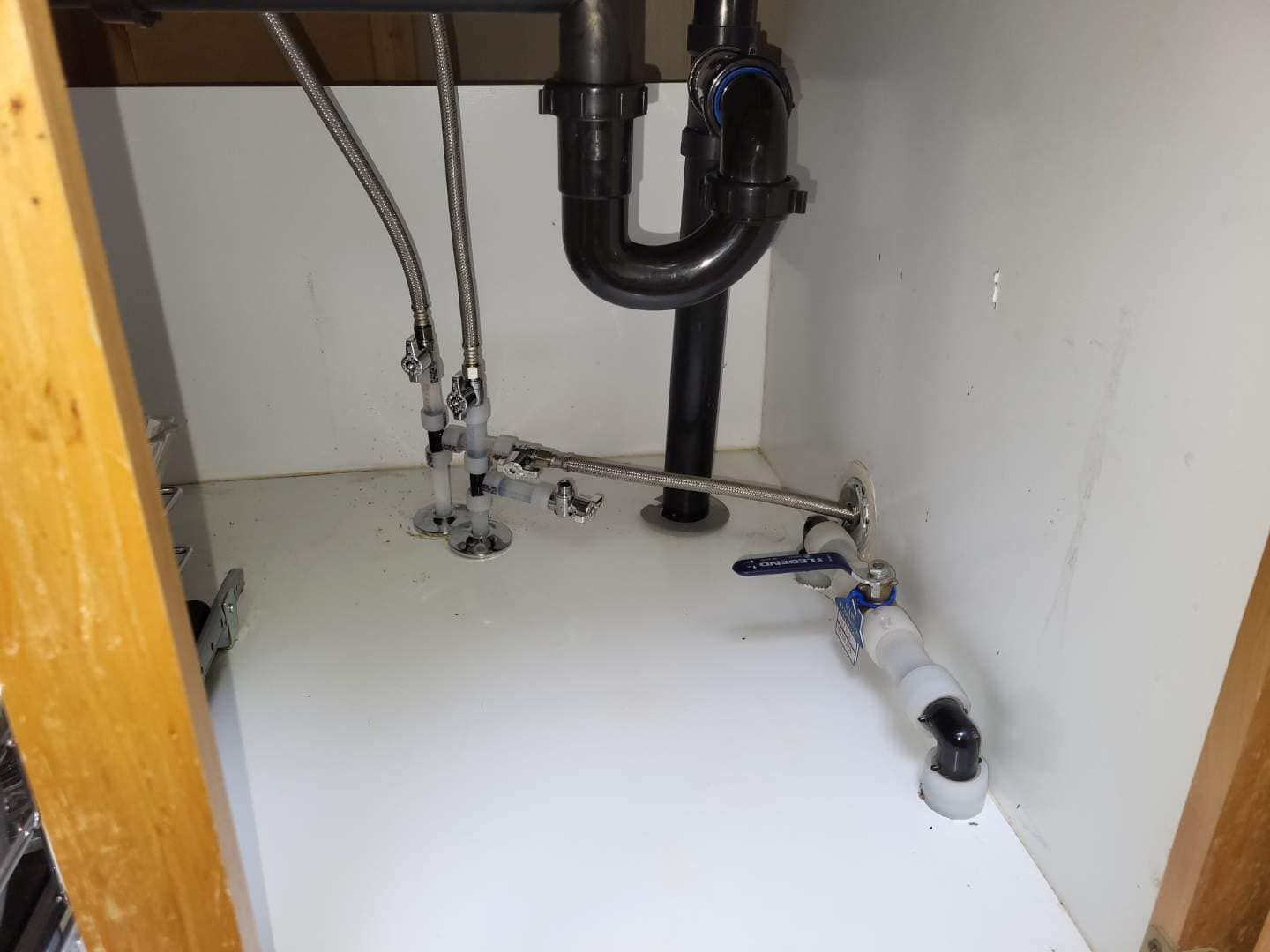 A bathroom sink with a plumbing pipe underneath it.