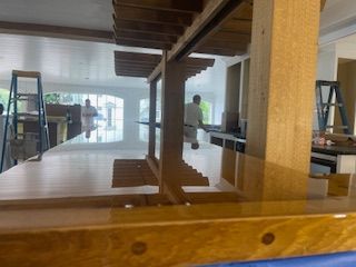 A reflection of a person in a mirror in a room.