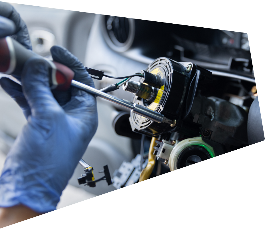 Technician working on inside of vehicle | Young's Auto & Services