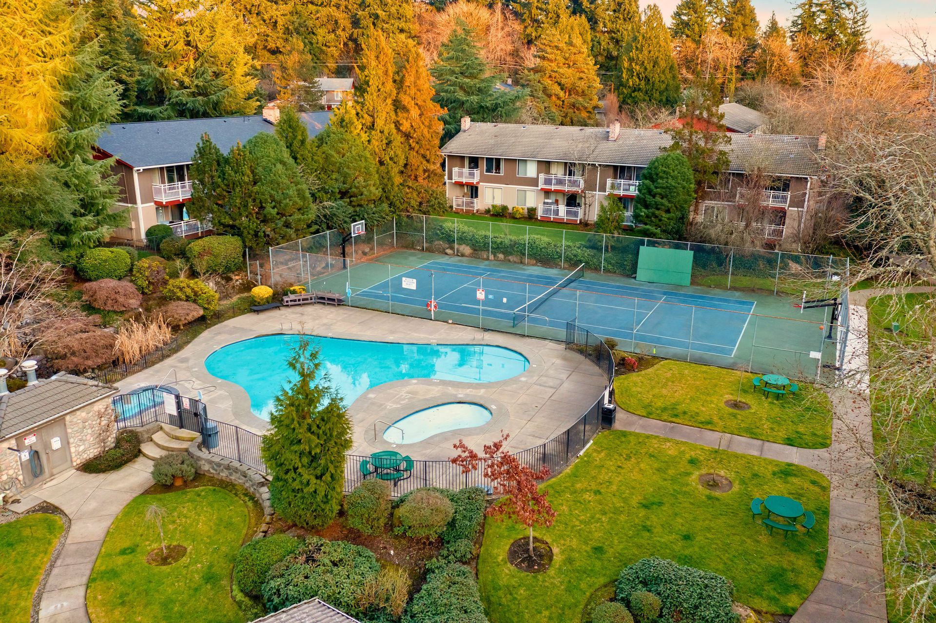Aerial view of pool, hot tub, tennis courts and common area amenities
