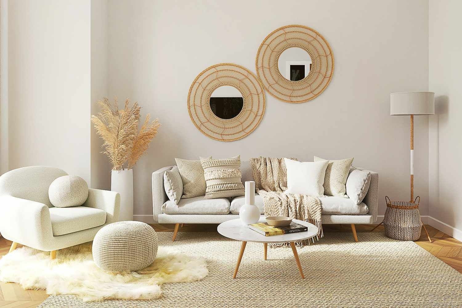 A living room with a couch , chair , coffee table and two mirrors on the wall.