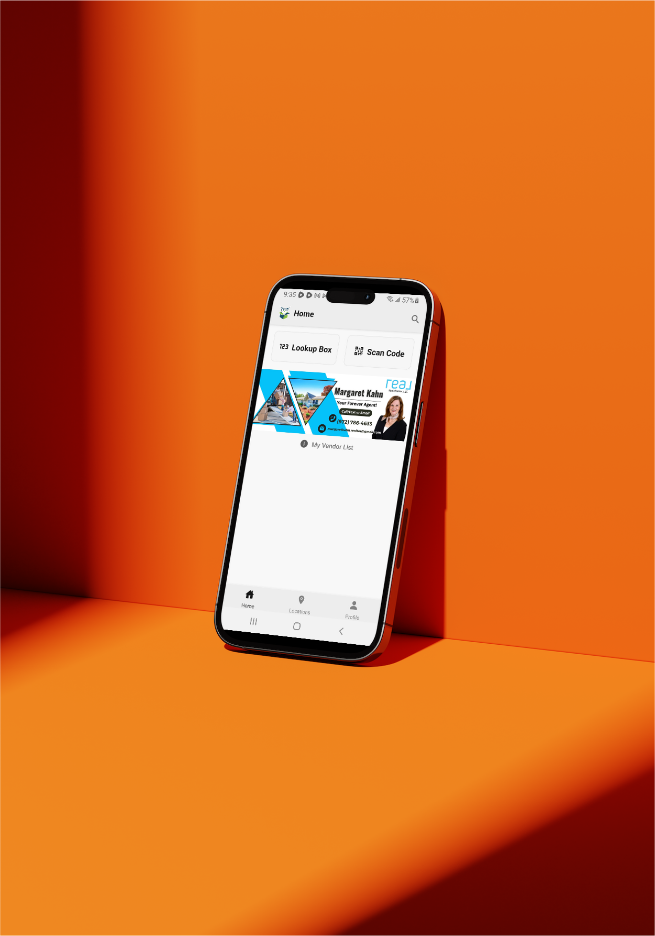 A cell phone is sitting on top of an orange table.