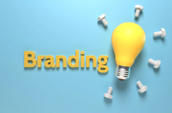 A hand is holding a pen and drawing contact icons on a yellow background.