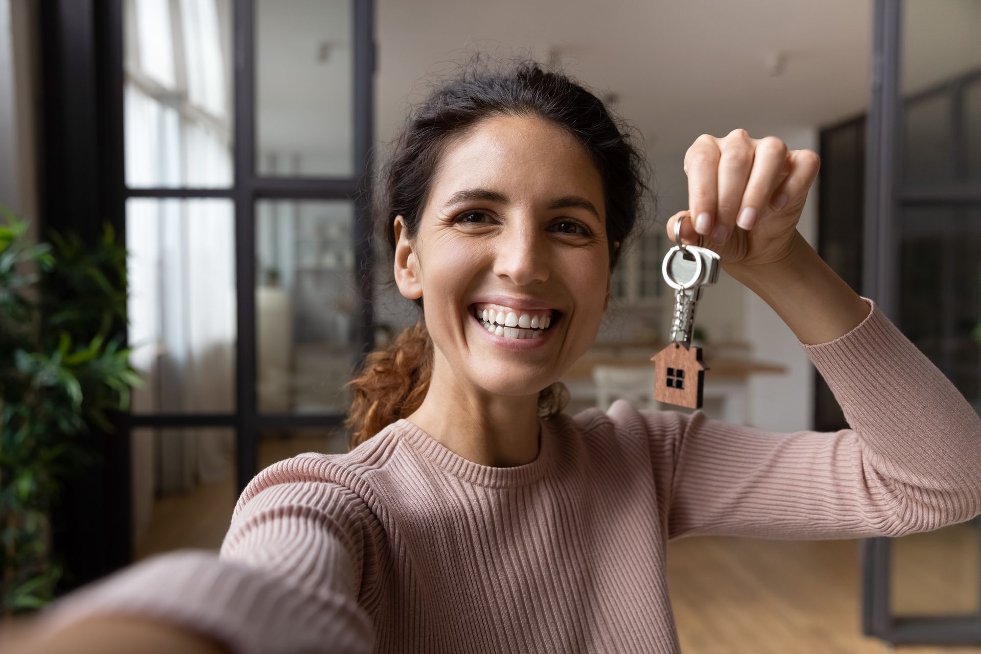 Woman Holding House Keys