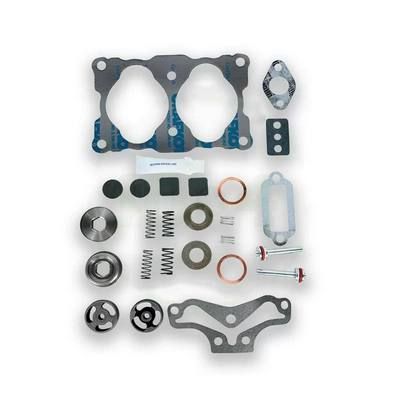 Kit de juntas de motor con varios componentes dispuestos.