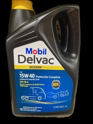 Un envase de aceite Mobil Delvac negro con tapa amarilla. Contiene el texto 15W-40, 