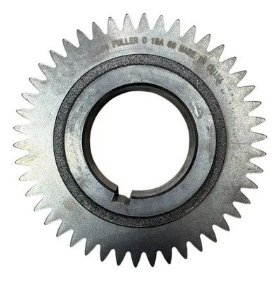 Engranaje de metal con dientes y un orificio central; estampado 